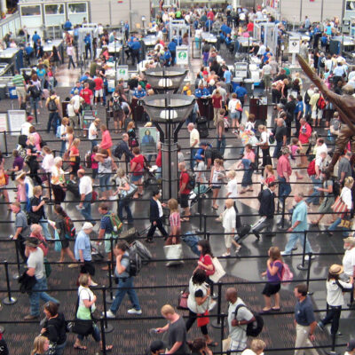 Crowded aiport line seen from above