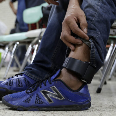 Image of an ankle monitor being worn