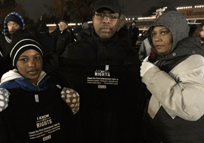 People in Ferguson, holding up our Know Your Rights t-shirts