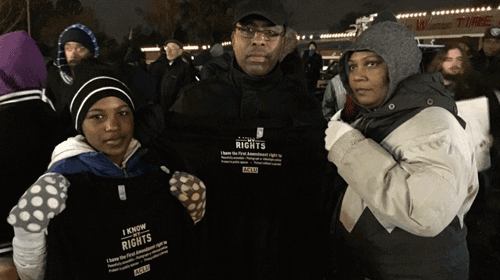 People in Ferguson, holding up our Know Your Rights t-shirts
