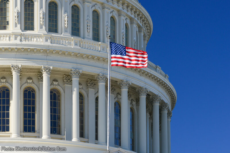 US Capitol Building with flag flying