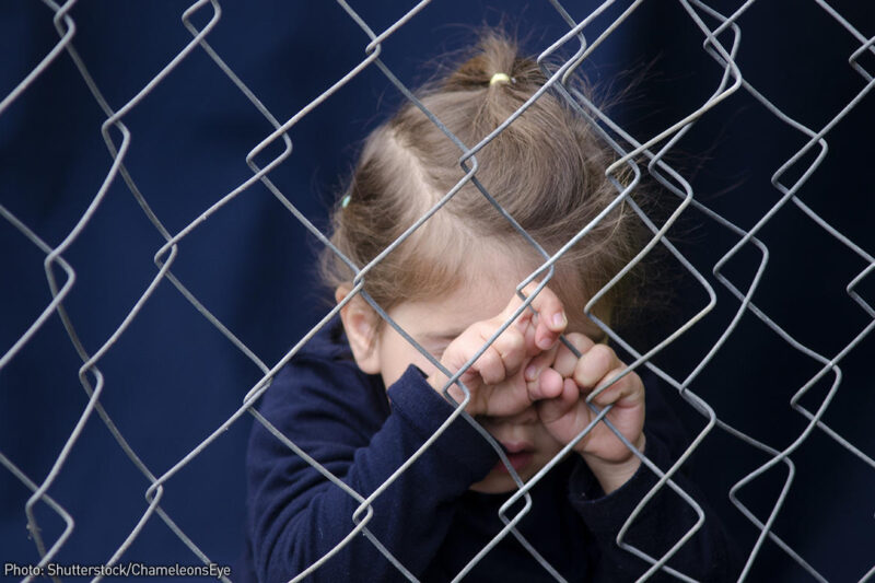 Child on fence