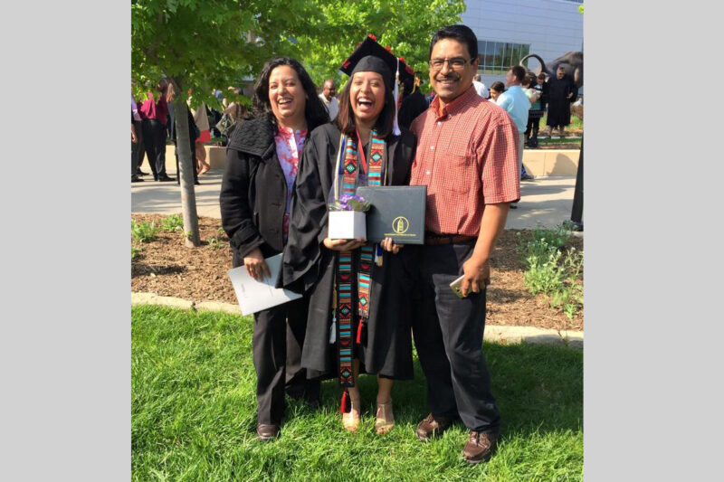 Maria Marquez Hernandez with her parents at her graduation