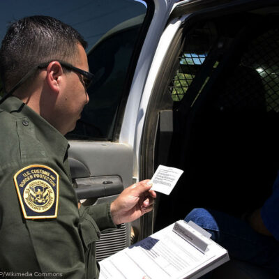 Border Patrol agent reads the Miranda rights to a Mexican national arrested for transporting drugs