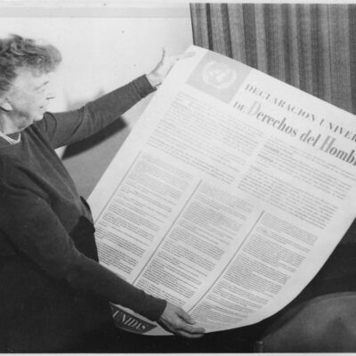 Eleanor Roosevelt holds a copy of the Spanish-language version of the Universal Declaration of Human Rights.