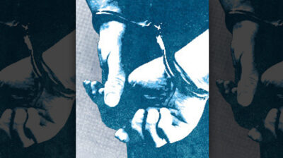 A pair of hands in handcuffs