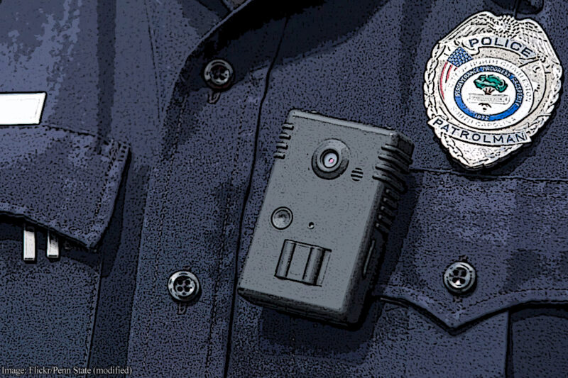 Closup of a body camera on the front of a police officer's uniform