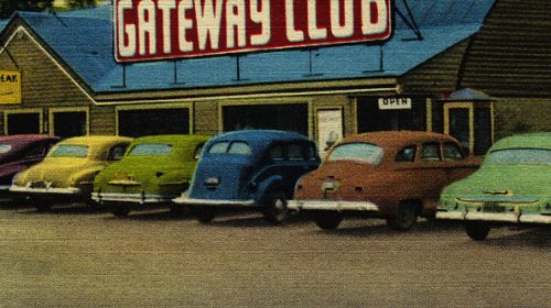 Old postcard of cars in parking lot