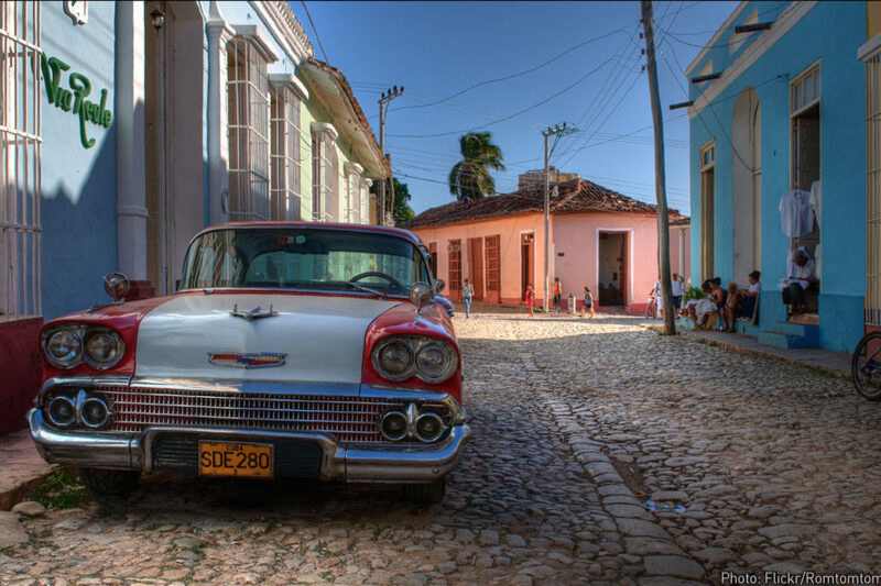Photo of vintage car parked on Cuban street