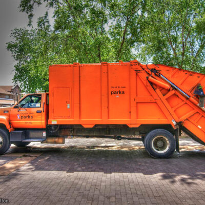 Big orange garbage truck