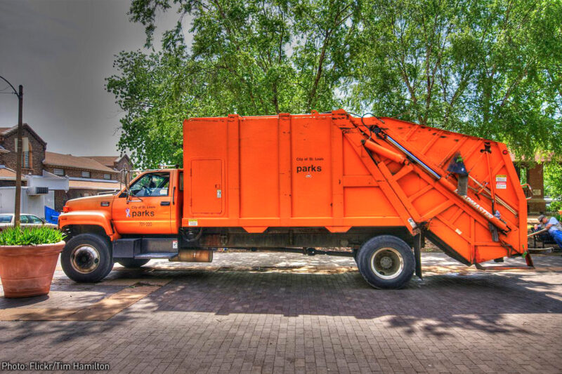 Big orange garbage truck