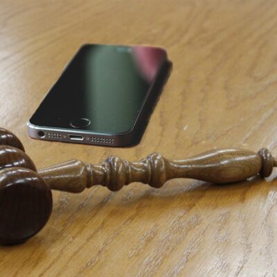Cell phone next to gavel
