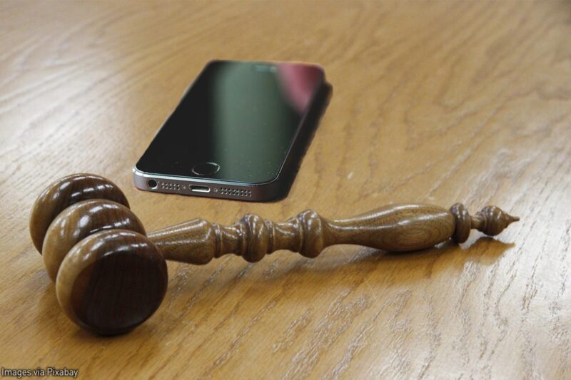 Cell phone next to gavel