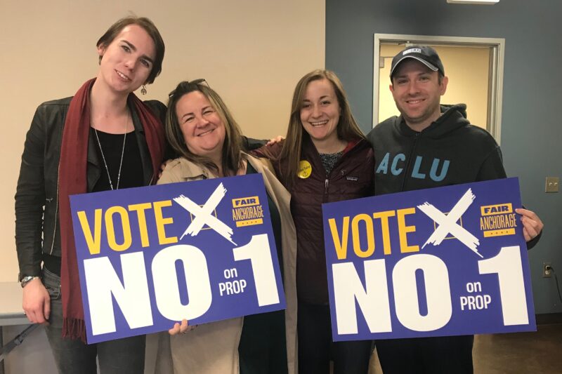 From left: Lillian Lennon (Transgender Community Organizer, ACLU of Alaska); Liz Welch (ACLU); Kati Ward (Fair Anchorage Campaign Manager); Joshua Decker (Executive Director, ACLU of Alaska). All holding "Vote no on prop 1 signs."