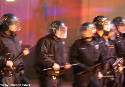 Photo of police standing with batons