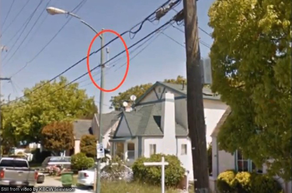 Photo of microphone on street pole next to house