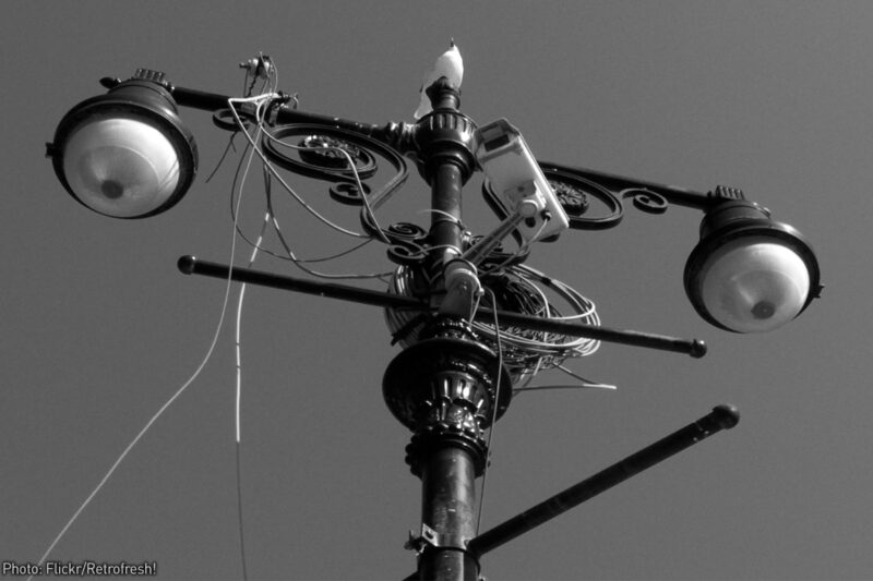 Eye-like streetlights with camera and wires attached