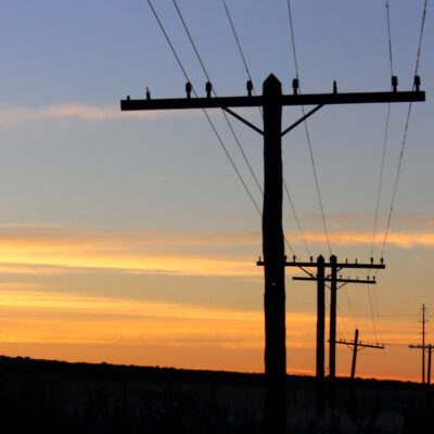 Old telephone lines at dawn