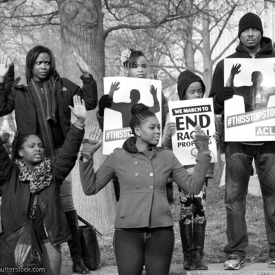 #BlackLivesMatter protesters holding ACLU signs