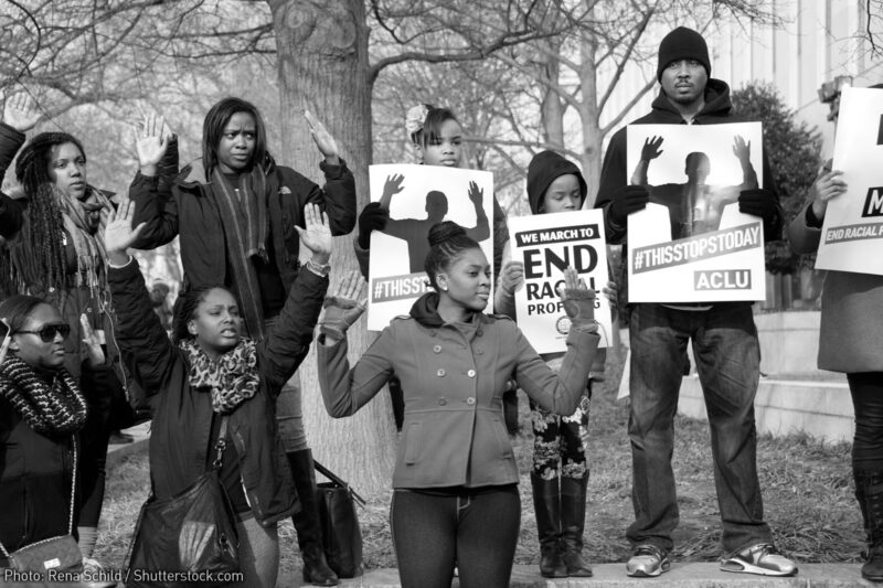 #BlackLivesMatter protesters holding ACLU signs