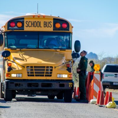 Border Patrol stops school bus at a checkpoint.
