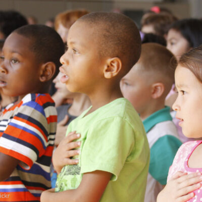 Students pledge allegiance to the flag.