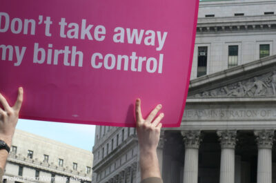 Protester holding up "Don't take away my birth control" sign