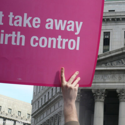 Protester holding up "Don't take away my birth control" sign