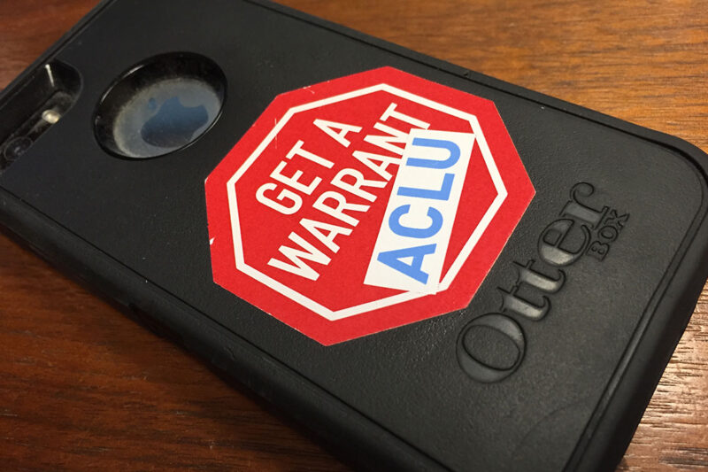 iPhone with "Get a Warrant - ACLU" sticker