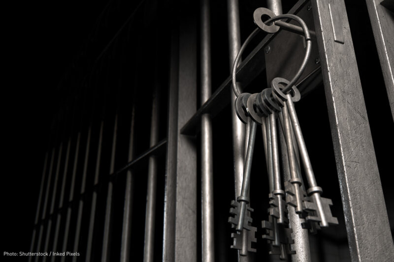 Prison bars and key chain