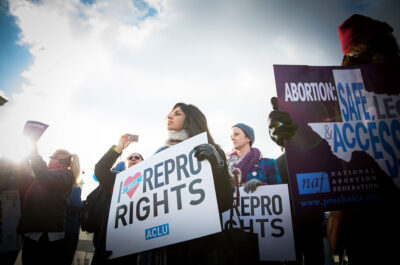Protesters at an abortion rally holding signs