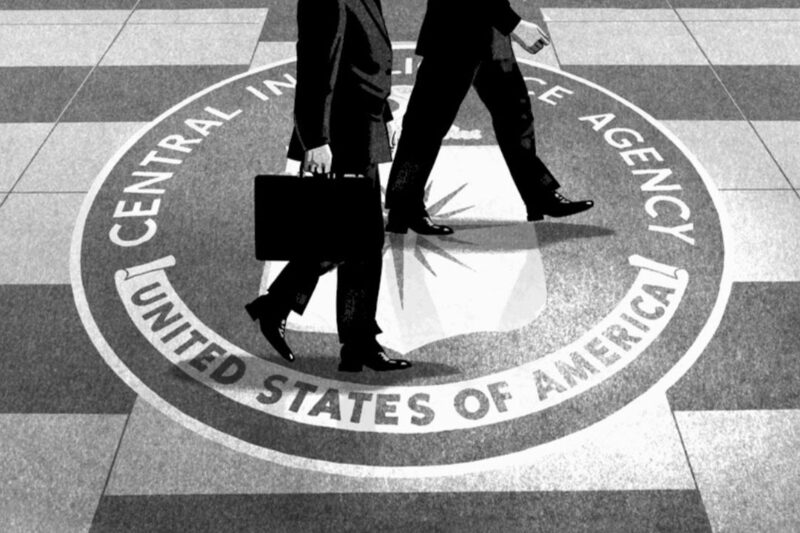 CIA agents walking across floor with CIA seal
