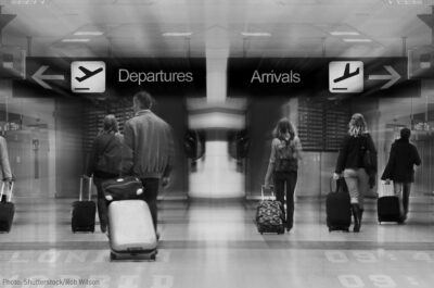 Travelers walking through airport