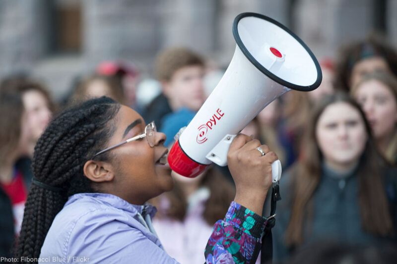 Student Protesting with a megaphone