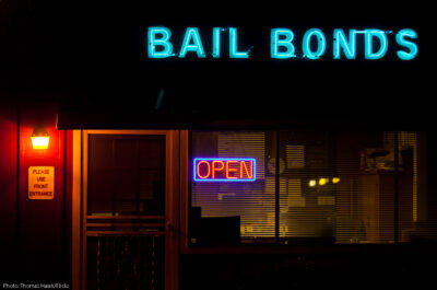 Neon bail bonds sign outside building