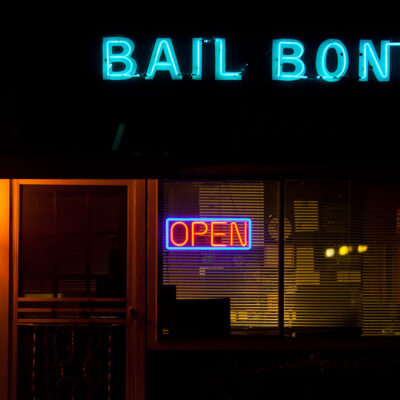 Neon bail bonds sign outside building