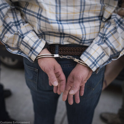A man handcuffed from behind