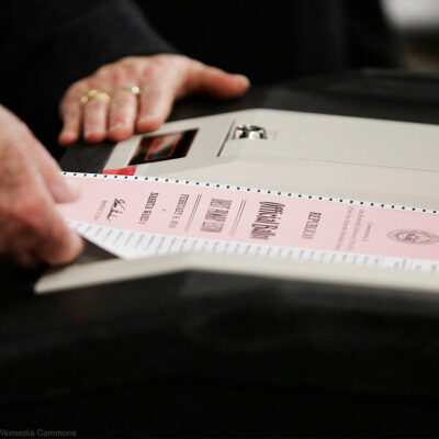 A ballot is entered into a machine at a polling site