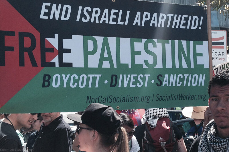 Protest with Free Palestine Boycott Divest Sanction Banner