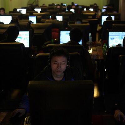 People use computers at an Internet cafe in Chengdu in southwest China's Sichuan province