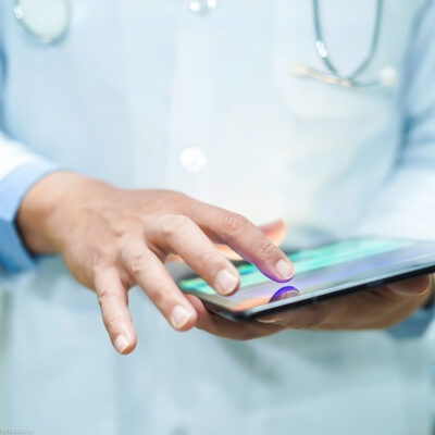 A doctor using a tablet
