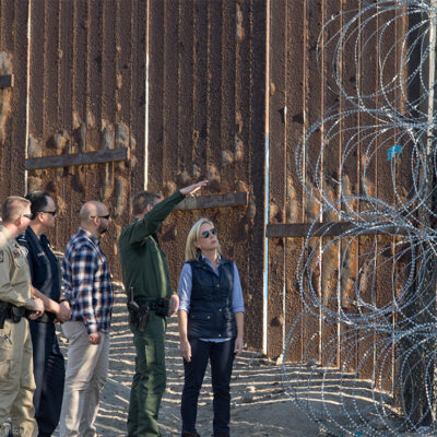 Secretary of Homeland Security Kirstjen M. Nielsen near the border fence at Border Field State Park