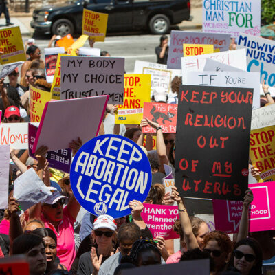 Demonstrators marching against bans on abortion