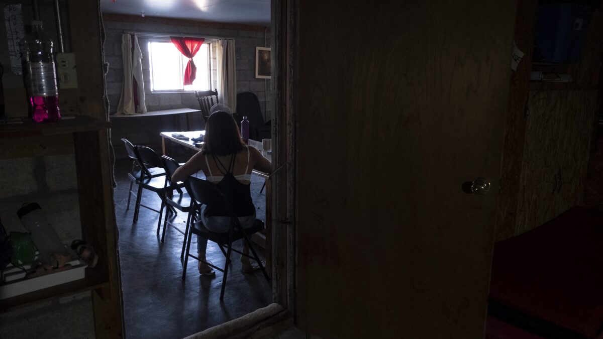 Julia sits in a home found for her by legal workers in Ciudad Juarez, Mexico, October 10, 2019.