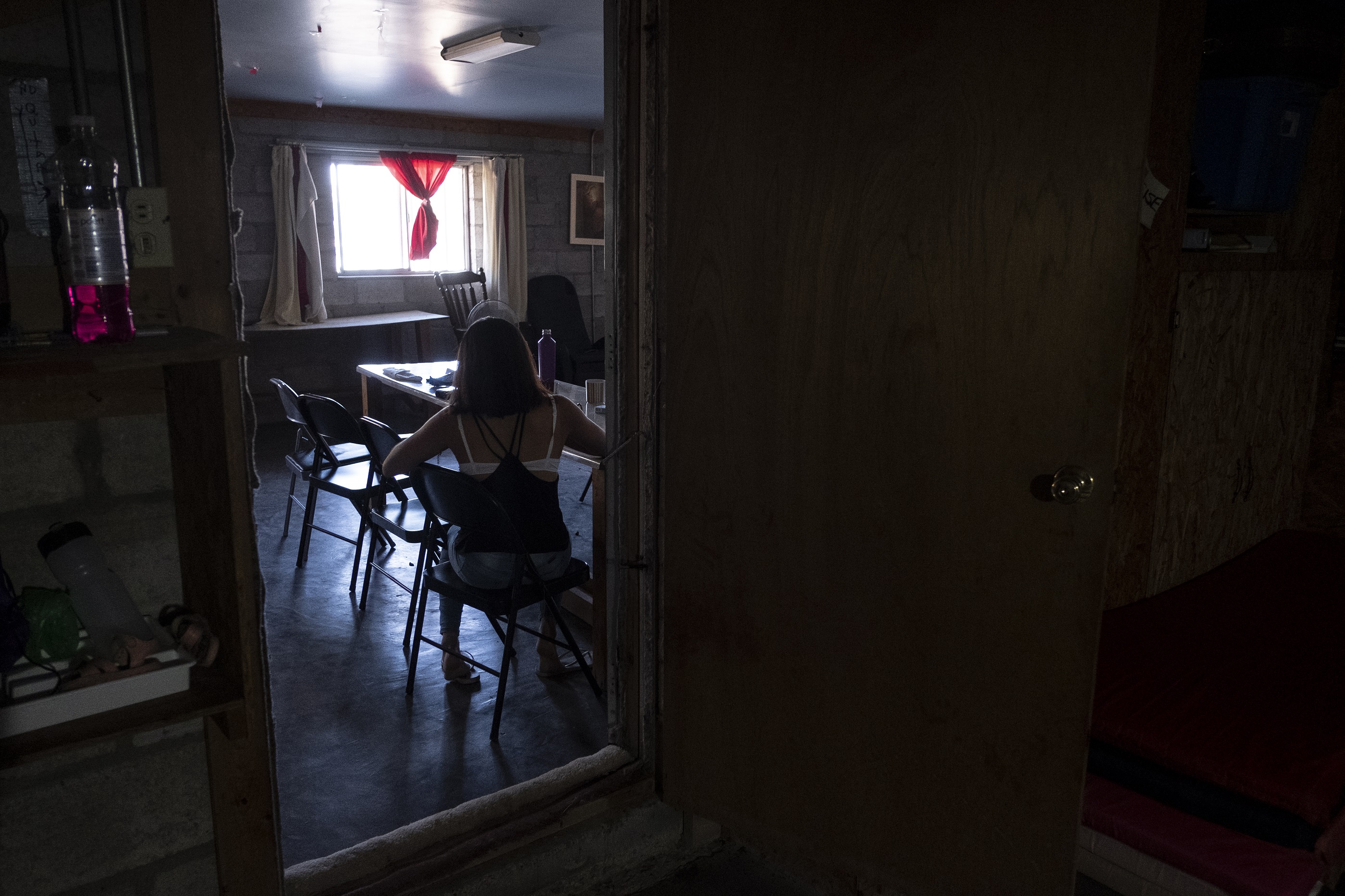 Julia sits in a home found for her by legal workers in Ciudad Juarez, Mexico, October 10, 2019.