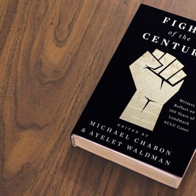 A black book titled "Fight of the Century" edited by Ayelet Waldman and Michael Chabon, lies on a wooden table