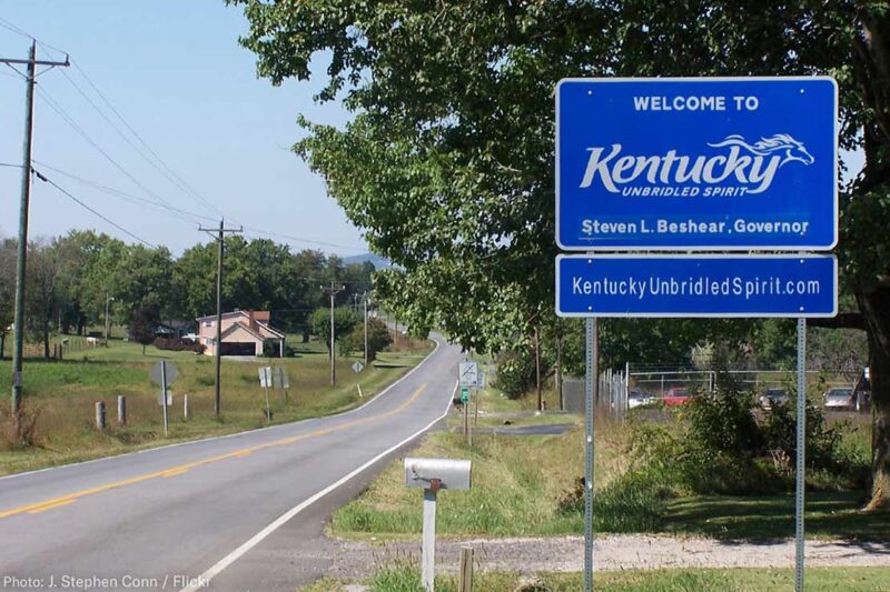 A Welcome to Kentucky road sign with the name of Governor Steven L. Brashear