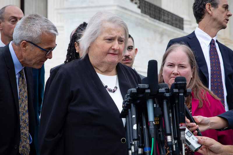 Aimee Stephens speaks with reporters outside the Supreme Court.