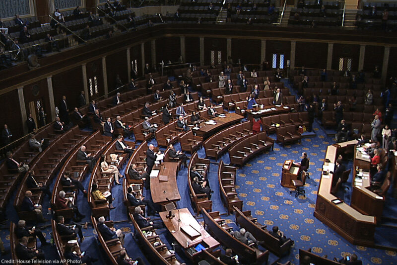 Members of the House practice social distancing as they sit on the floor of the House of Representatives in the U.S. Capitol and debate on the coronavirus stimulus package known as the CARES Act. By the end of March, the legislation was signed and passed, but has been under scrutiny for its exclusion of assistance for immigrants.