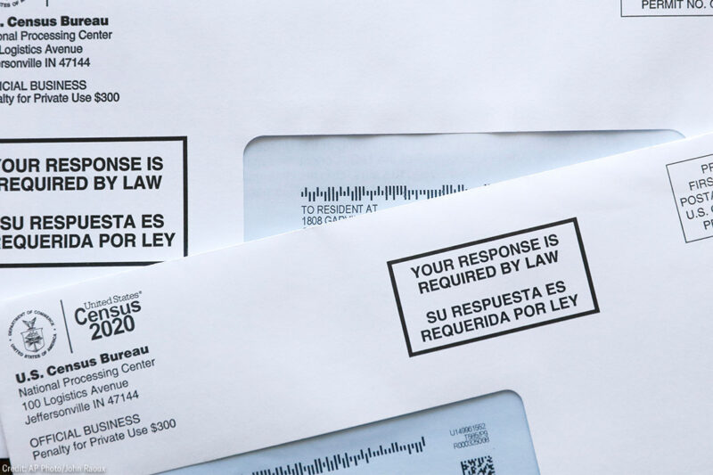 Two envelopes containing 2020 U.S. Census forms.